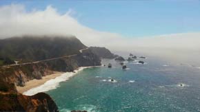 Aerial view of the Central Coast shoreline with cliffs, beach, and ocean